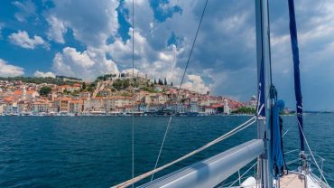 Sailing view of Split, Croatia with historic old town, terracotta rooftops, and Adriatic Sea