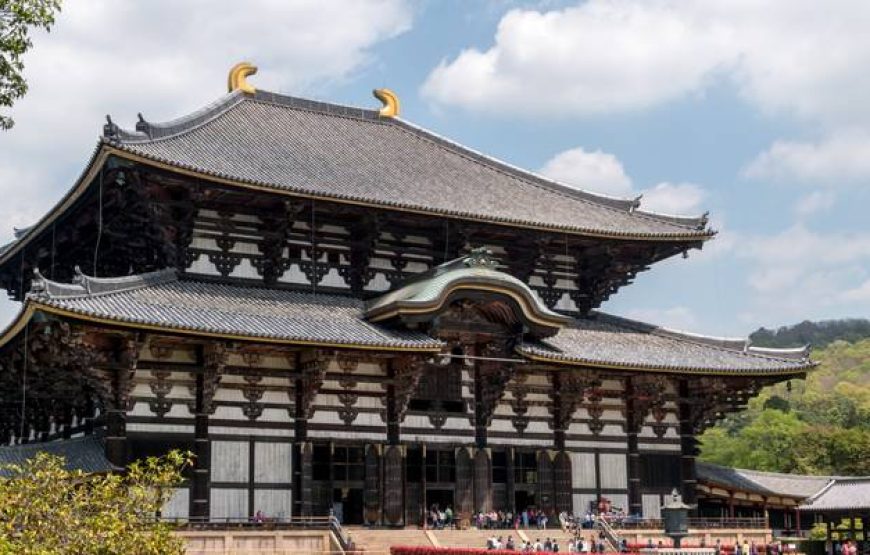 Epic Japan tour at Todai-ji Temple in Nara, showcasing traditional Japanese architecture with wooden details and curved rooftops.